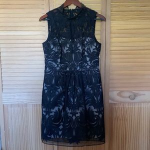 Beautiful black lace over cream lining sleeveless dress.